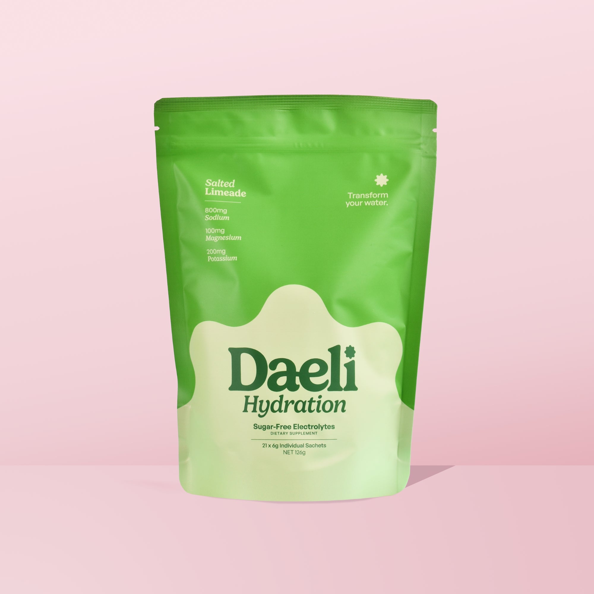 Daeli Hydration Salted Limeade electrolyte powder pouch on a pink background - sugar-free hydration with essential electrolytes.