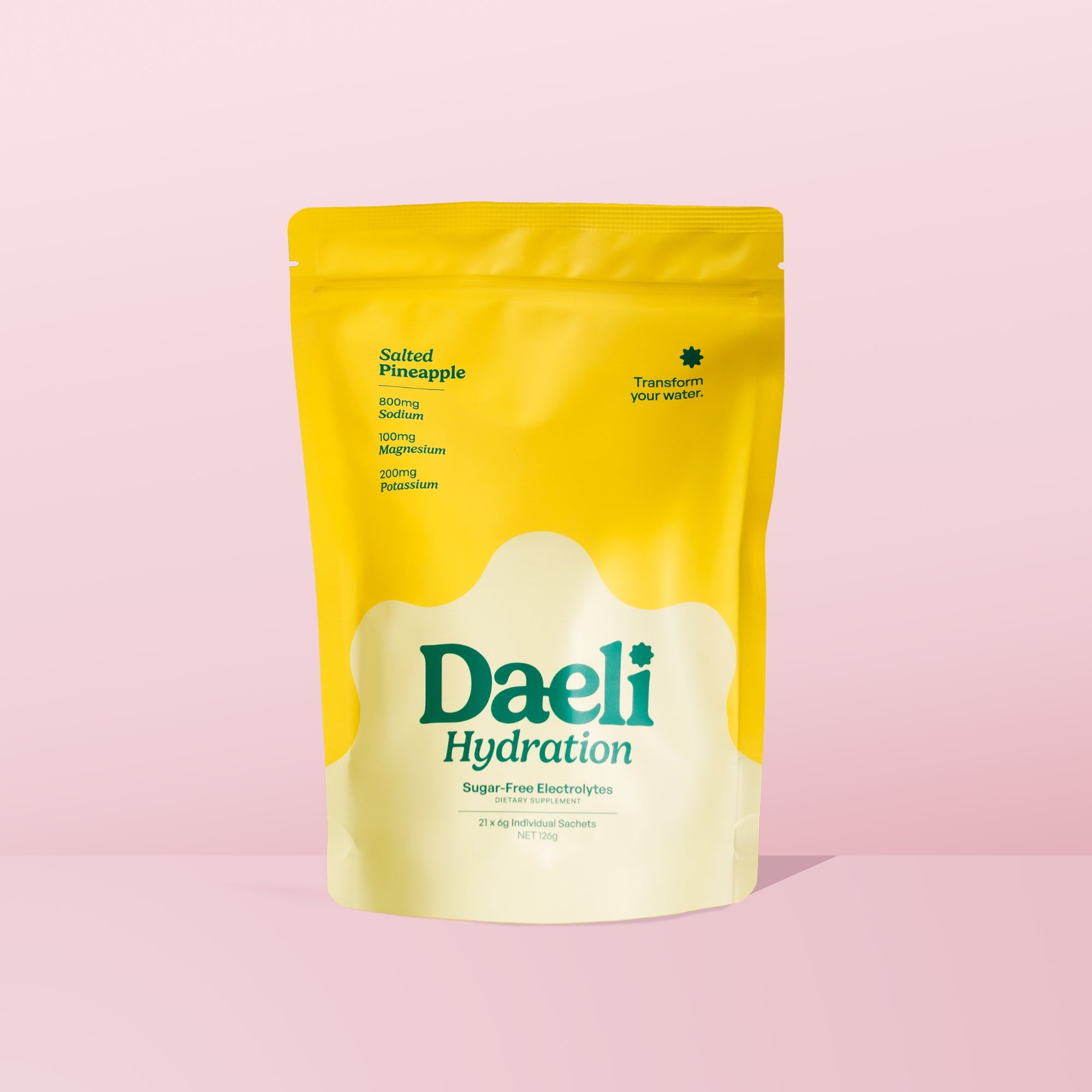 Daeli Hydration Salted Pineapple electrolyte powder pouch on a pink background - sugar-free hydration with essential electrolytes.