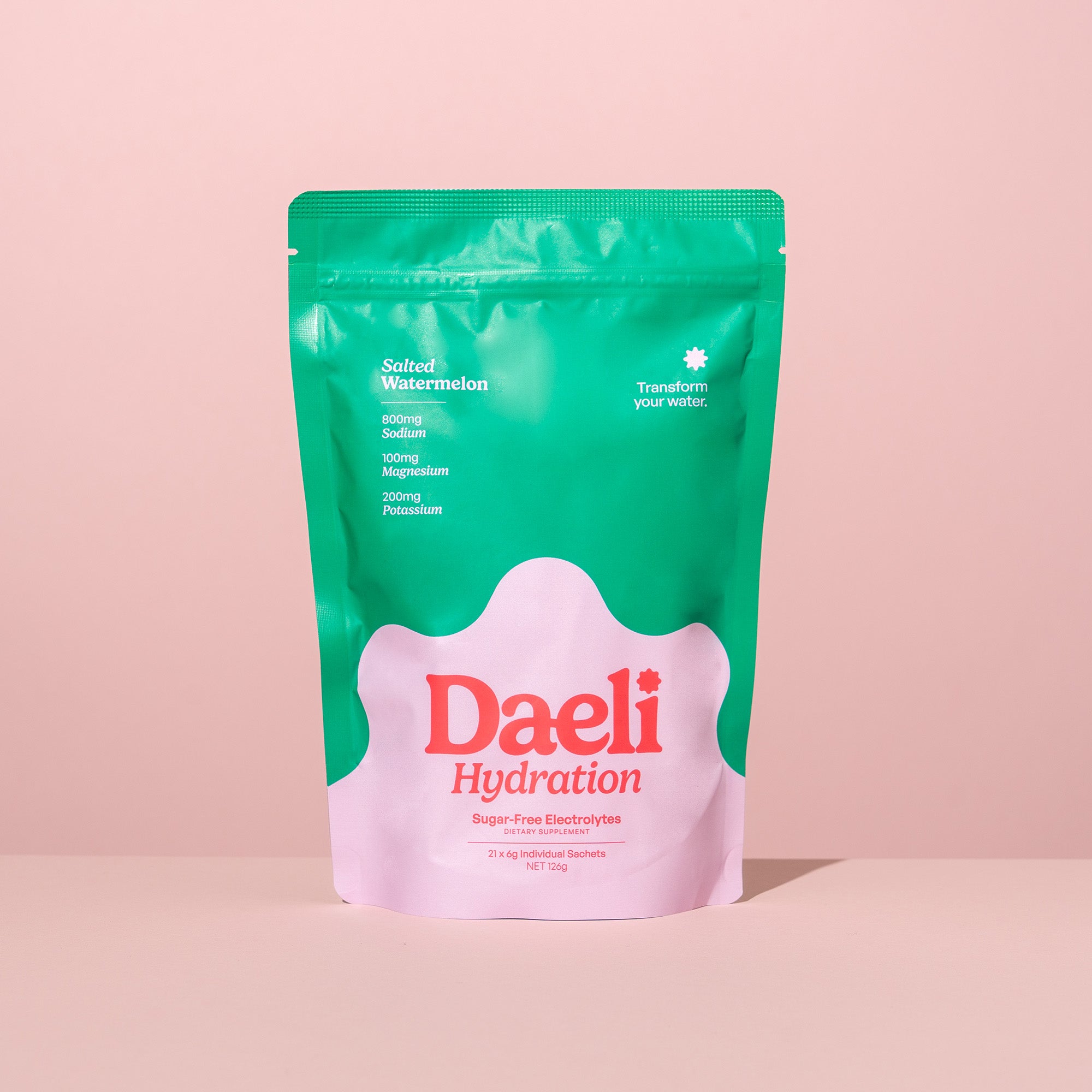 Daeli Hydration Salted Watermelon electrolyte powder pouch on a pink background - sugar-free hydration with essential electrolytes.