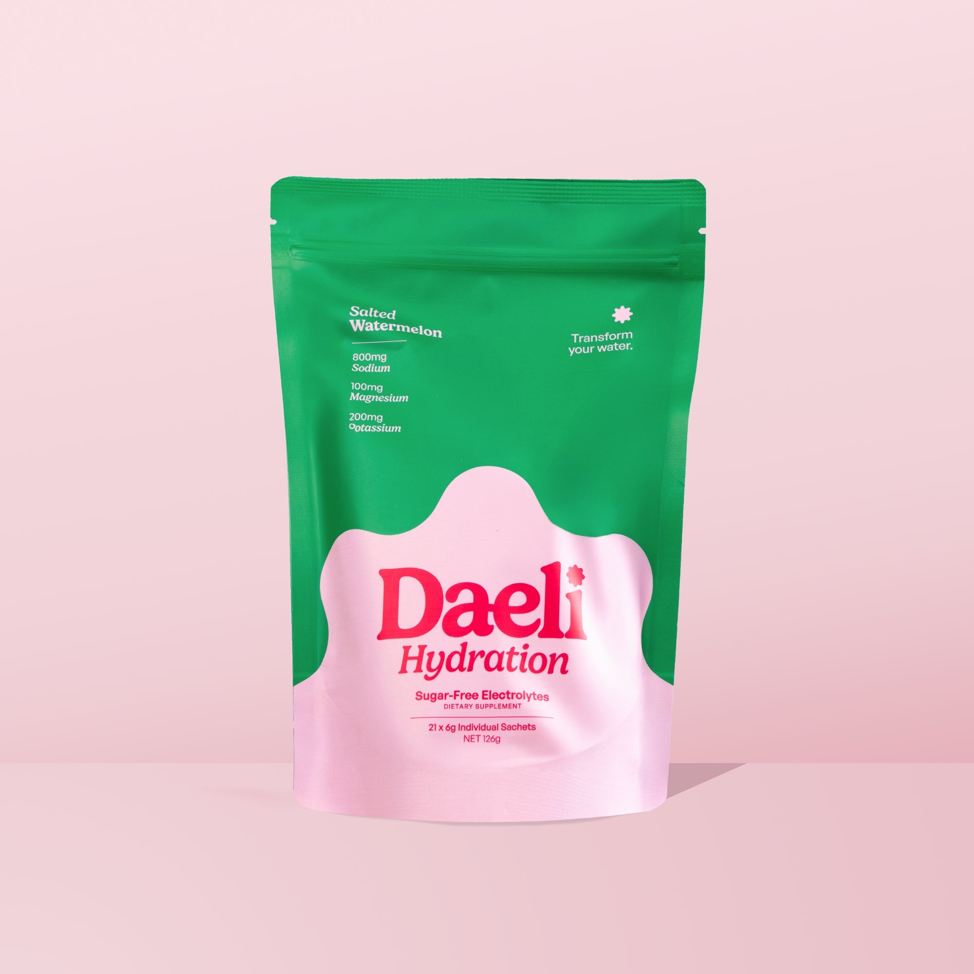 Daeli Hydration Salted Watermelon electrolyte powder pouch on a pink background - sugar-free hydration with essential electrolytes.